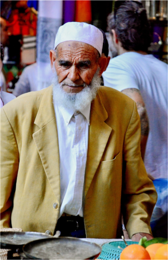 Main image Old Berber Man in the Souks of Marrakech - Fine Art Photo Print under Acrylic Glass