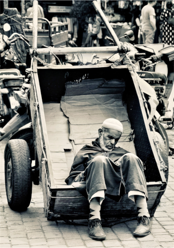 Main image Time for a Break - Souks of Marrakech-Morocco; by J. Schleenbecker; Collection Colors of Marrakech; Copyright 2025. Fine Art Photo Print under Acrylic glass; Art Box Aluminium Frame 50 mm.