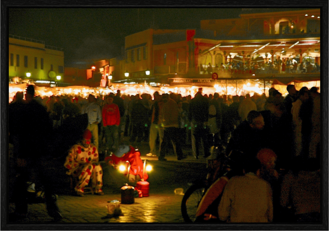 Clown on Djeema El Fna Square - Marrakech Medina; Photo Art Print under Acrylic Glass; Oak Wood Frame 15 mm - Colors of Marrakech - Photo Art Gallery