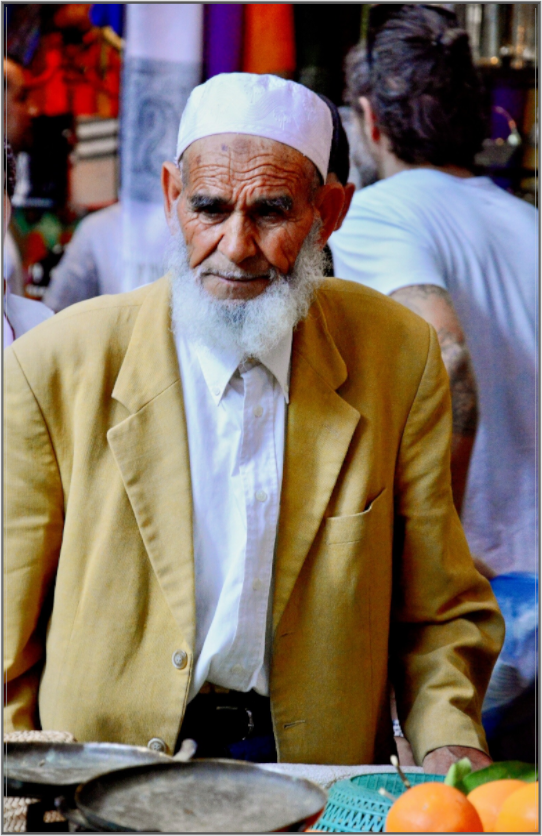 Main image Old Berber Man in the Souks of Marrakech - Fine Art Photo Print under Acrylic Glass