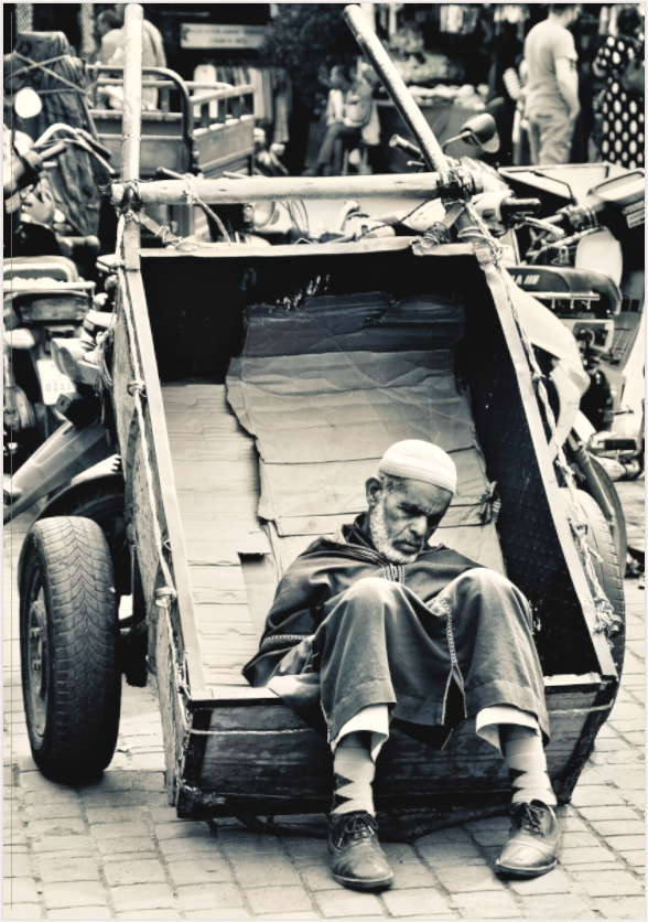Main image Time for a Break - Souks of Marrakech-Morocco; by J. Schleenbecker; Collection Colors of Marrakech; Copyright 2025. Fine Art Photo Print under Acrylic glass; Art Box - White Maple Wood Frame 50 mm.